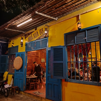 The yellow and blue exterior of Nhà Xưa 68 in Phu Quoc